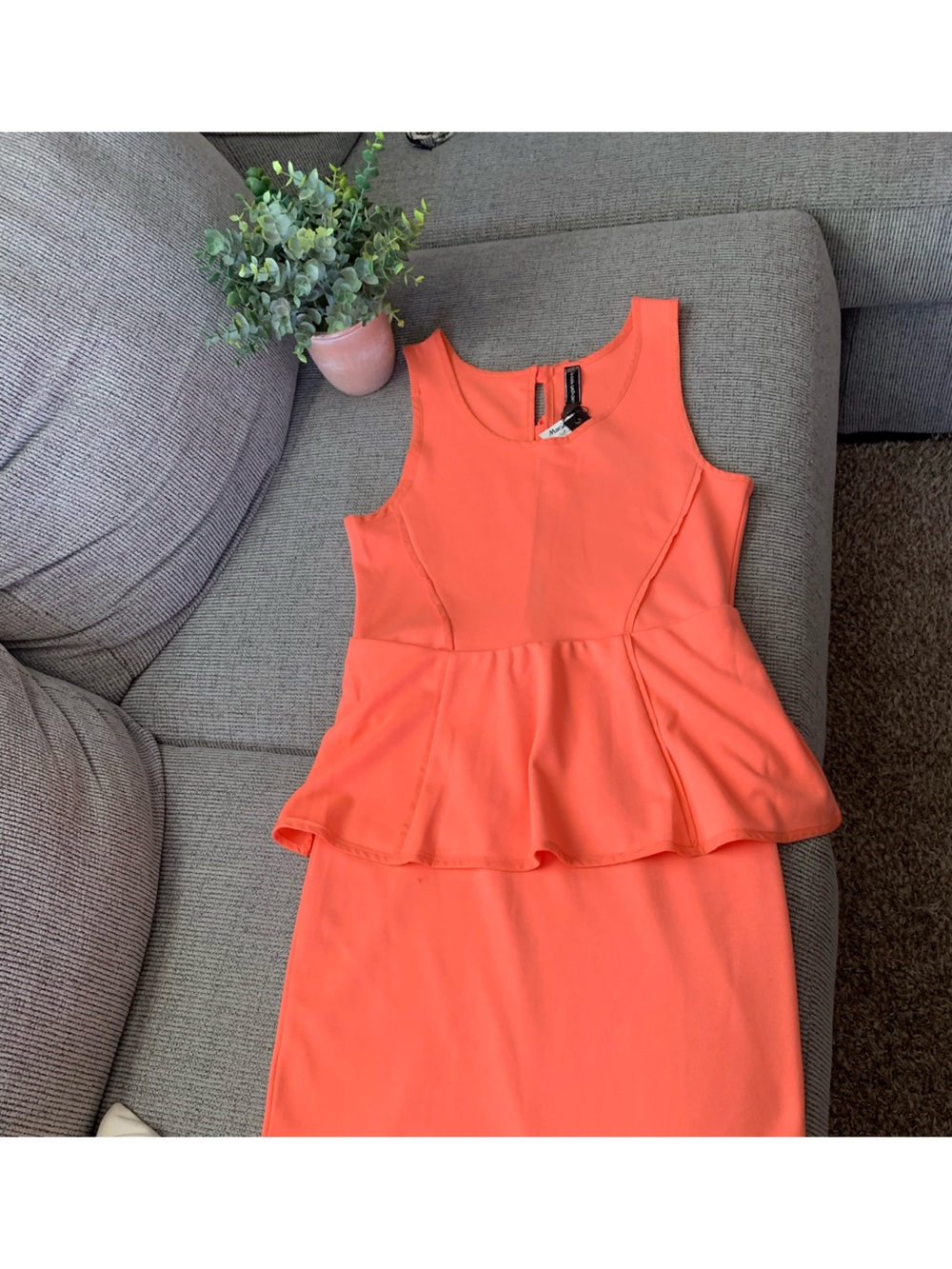 Sleeveless Coral Peplum Dress with Front Seams